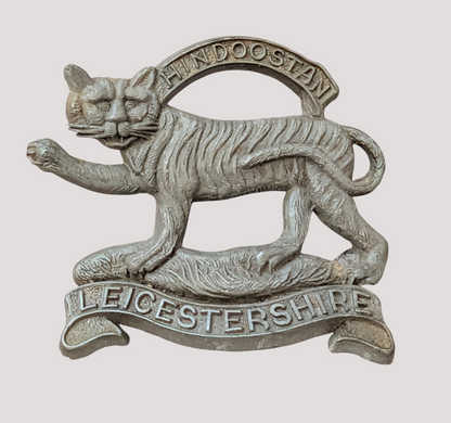 WW2 Plastic Economy Leicestershire Regiment Cap Badge with blades