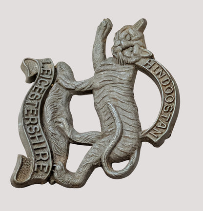 WW2 Plastic Economy Leicestershire Regiment Cap Badge with blades