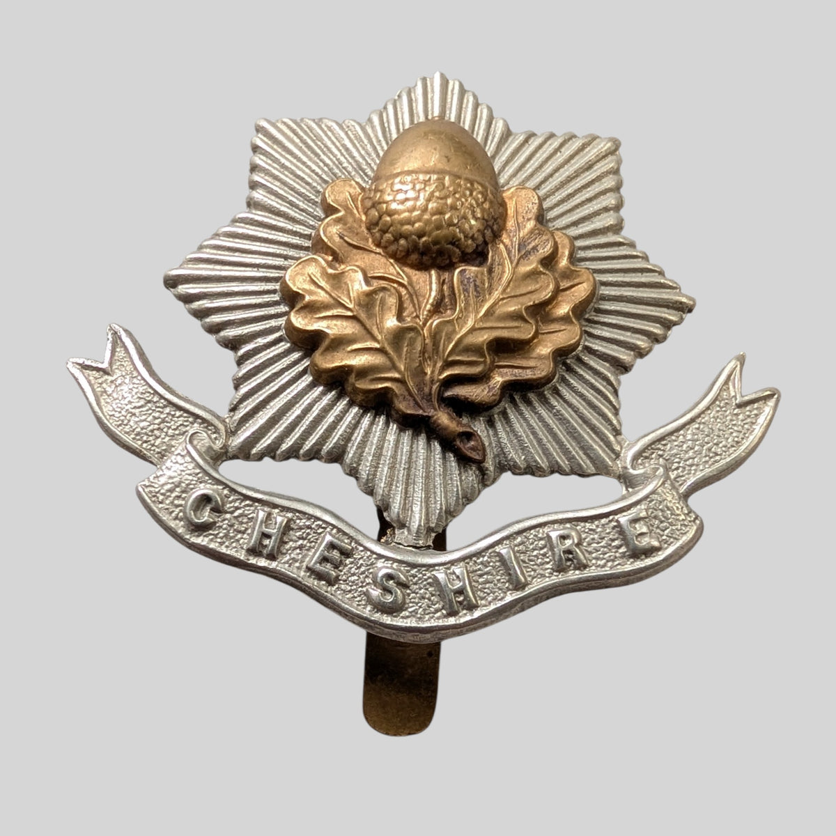 WW1 Cheshire Regiment Bimetal First Pattern  Cap Badge