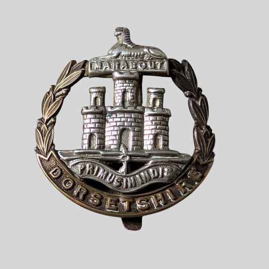 WW1 Era Dorsetshire Regiment Bimetal Cap Badge