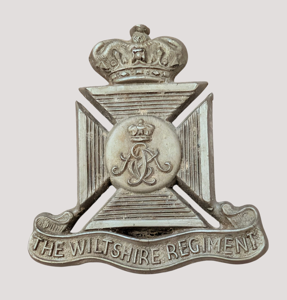 WW2 Plastic Economy Wiltshire Regiment Cap Badge with blades